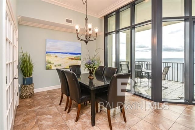 dining room featuring crown molding, a wall of windows, a chandelier, and light tile patterned flooring