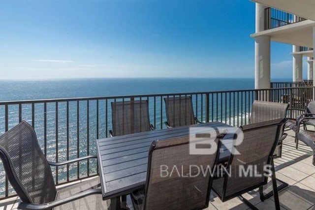 balcony featuring a water view