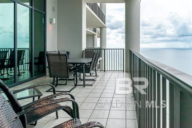 balcony featuring a water view