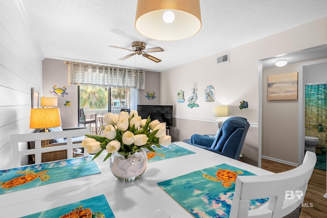 interior space with hardwood / wood-style floors, a textured ceiling, and ceiling fan