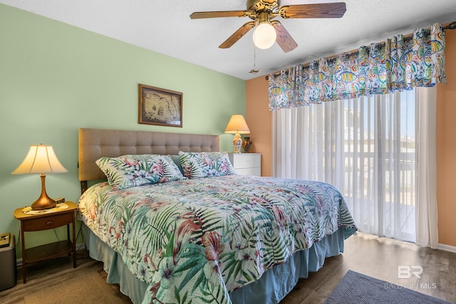 bedroom with ceiling fan and hardwood / wood-style floors