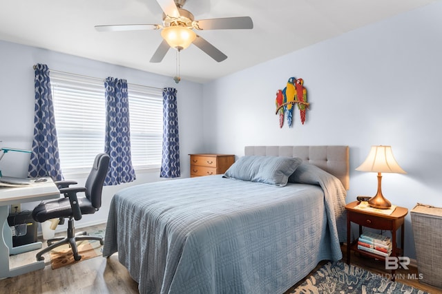 bedroom with ceiling fan and hardwood / wood-style floors