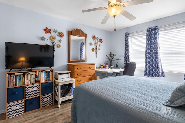 bedroom featuring ceiling fan and hardwood / wood-style flooring