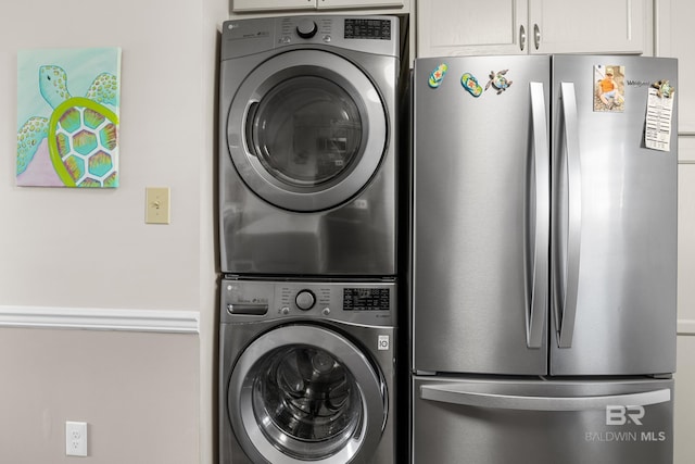 laundry room featuring stacked washer / dryer