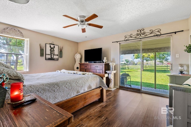 bedroom featuring hardwood / wood-style floors, ceiling fan, access to exterior, and a textured ceiling