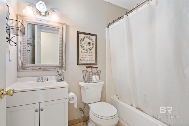 full bathroom with shower / bath combo, vanity, and toilet