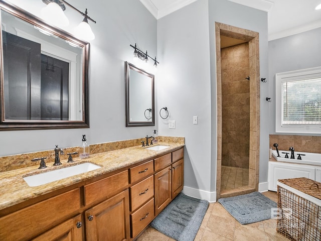 bathroom featuring plus walk in shower, tile patterned floors, crown molding, and dual bowl vanity