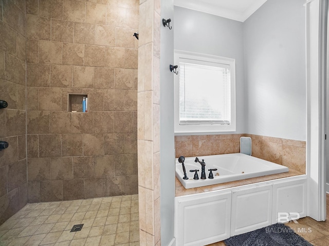 bathroom featuring ornamental molding and separate shower and tub