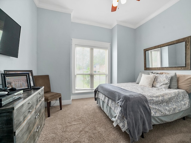 bedroom featuring crown molding, carpet floors, and ceiling fan