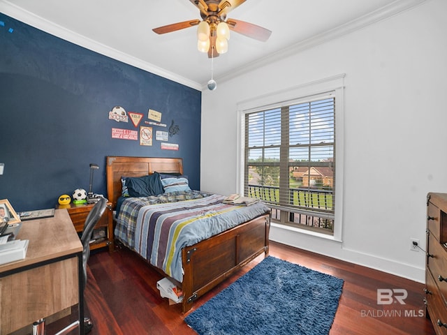 bedroom featuring ornamental molding, dark hardwood / wood-style floors, and ceiling fan