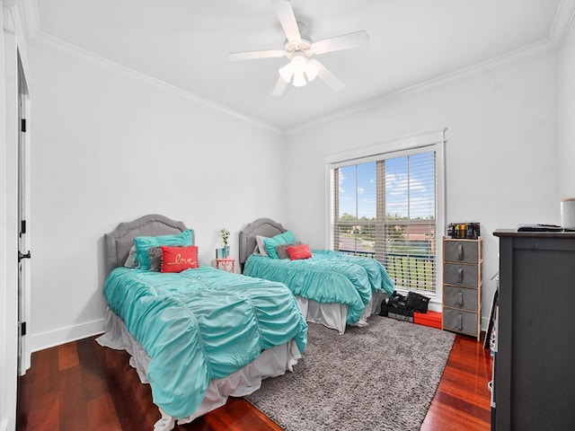 bedroom with dark wood-type flooring, ceiling fan, and ornamental molding