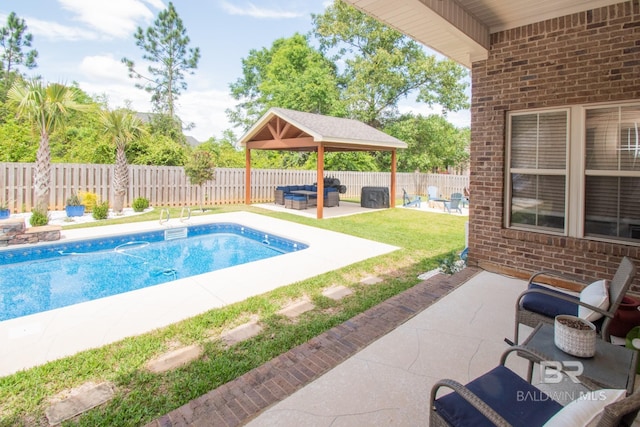 view of pool featuring an outdoor living space, a gazebo, and a patio area