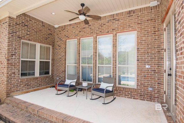 view of patio featuring ceiling fan