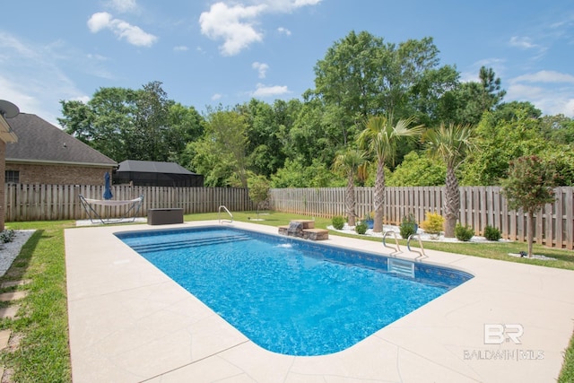 view of swimming pool featuring a patio, pool water feature, and a yard