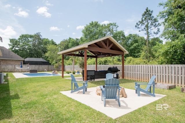 view of yard featuring a patio area, a gazebo, a fenced in pool, and outdoor lounge area