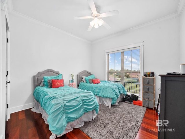 bedroom featuring dark wood-type flooring, crown molding, and ceiling fan