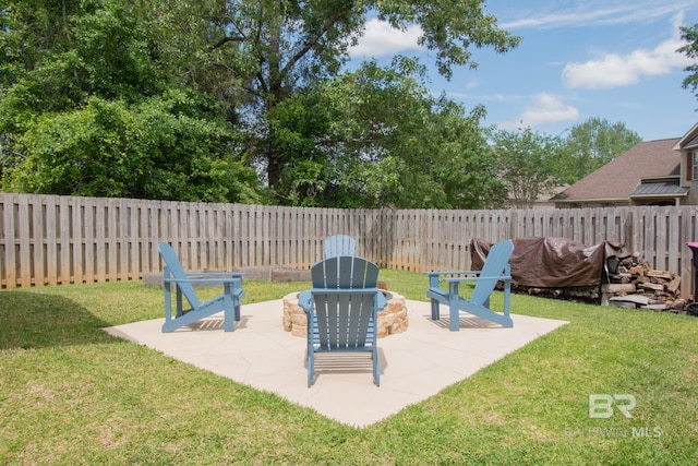 view of patio with an outdoor fire pit