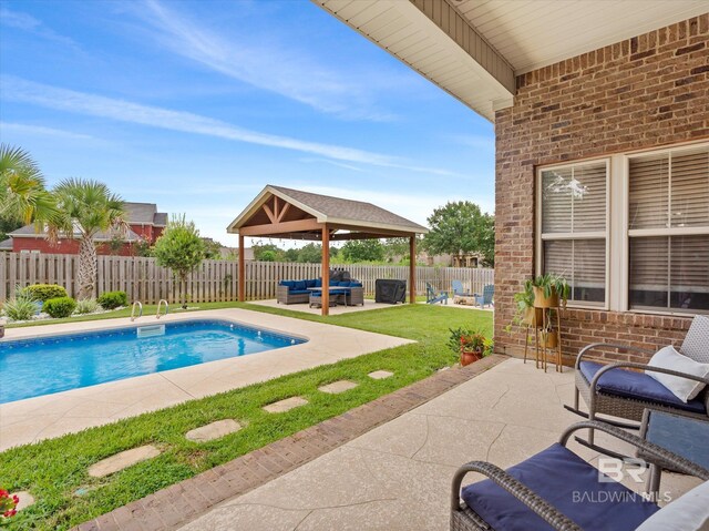 view of swimming pool with a patio and a gazebo