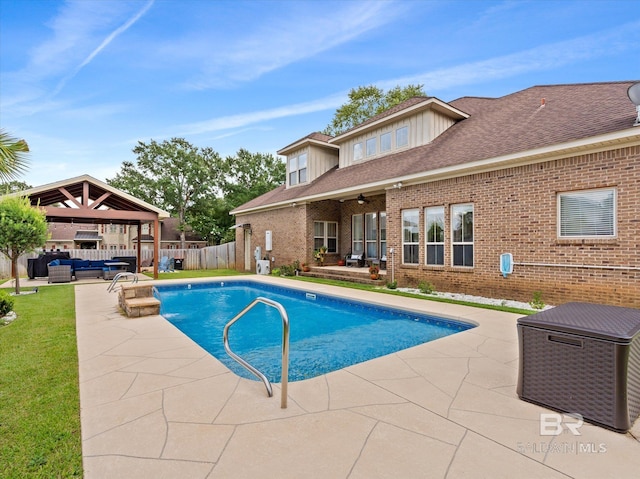 view of pool with a gazebo, a patio area, and an outdoor living space