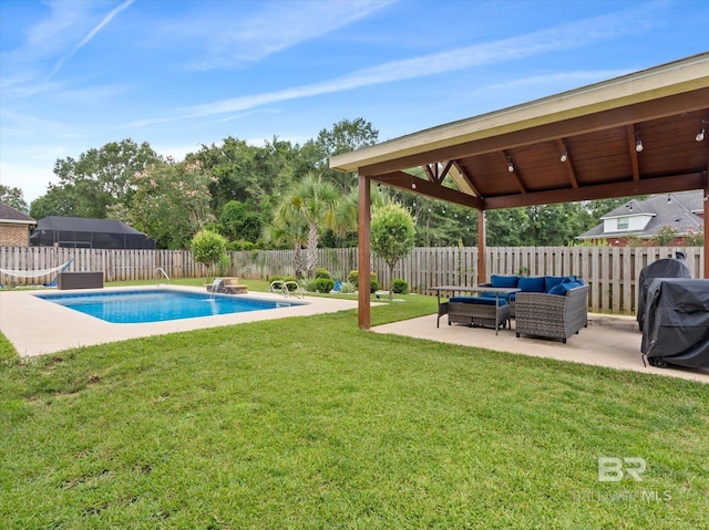 view of pool featuring a patio, an outdoor living space, a lawn, and a grill