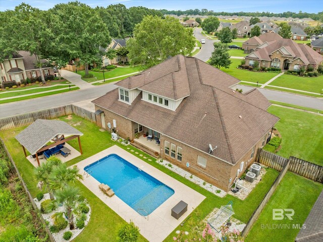 view of swimming pool with a yard, a patio area, and a gazebo