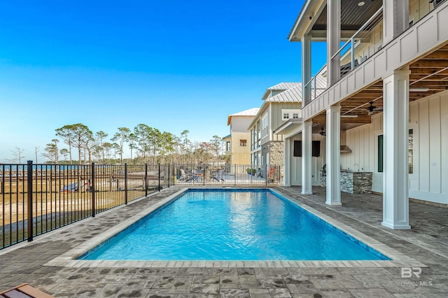 view of pool featuring a patio area and ceiling fan