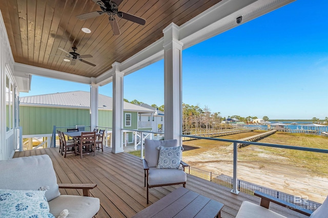 wooden deck featuring ceiling fan