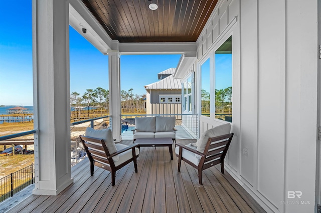 wooden terrace with outdoor lounge area