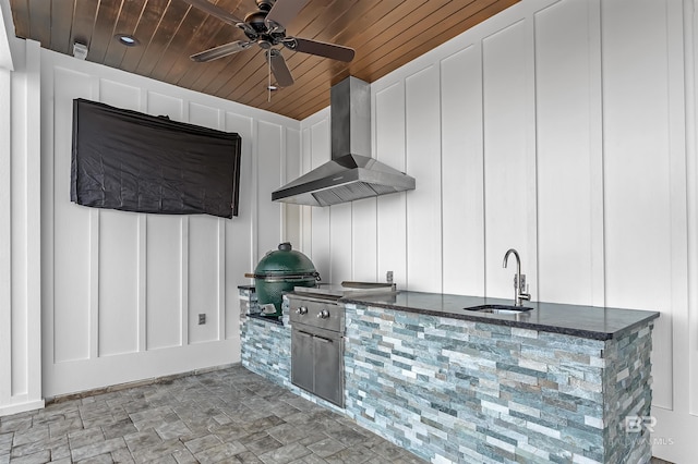 view of patio / terrace featuring area for grilling, ceiling fan, sink, and exterior kitchen