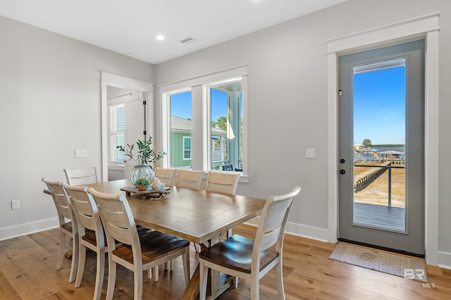 dining area with light hardwood / wood-style floors