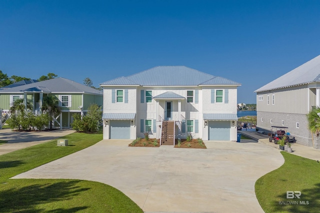 bi-level home with a front yard and a garage