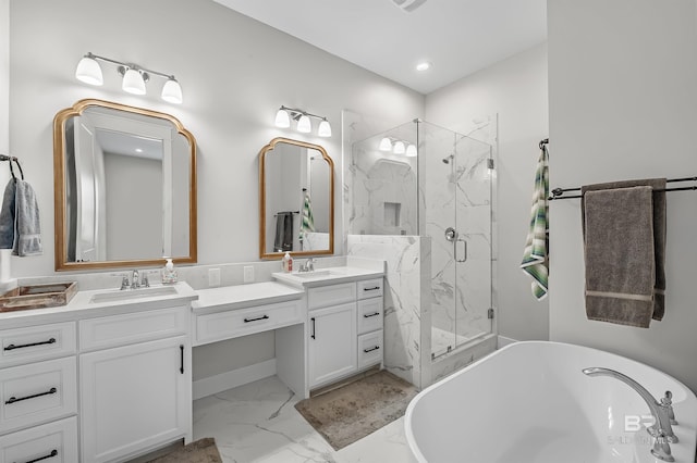 bathroom featuring vanity and shower with separate bathtub