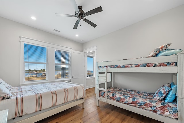 bedroom with ceiling fan and hardwood / wood-style floors