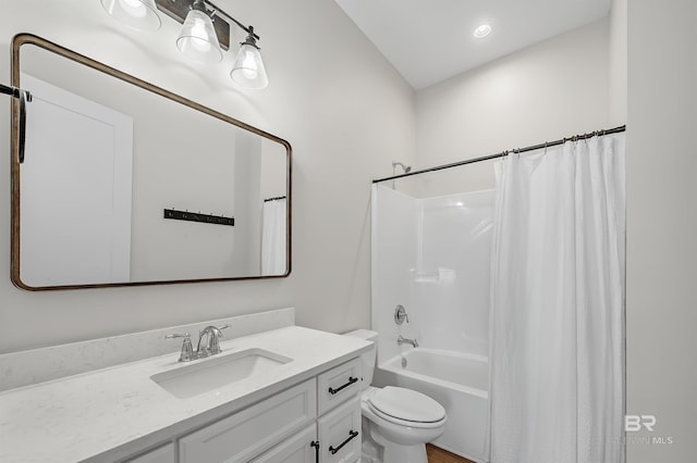 full bathroom with vanity, toilet, and shower / bath combination with curtain