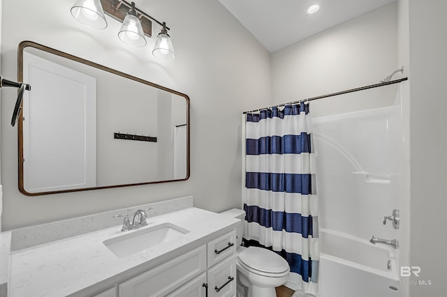 full bathroom featuring vanity, shower / tub combo with curtain, and toilet