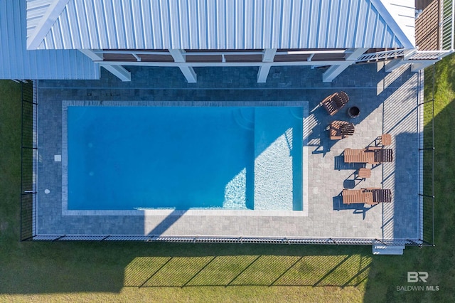 view of swimming pool with a yard and a pergola