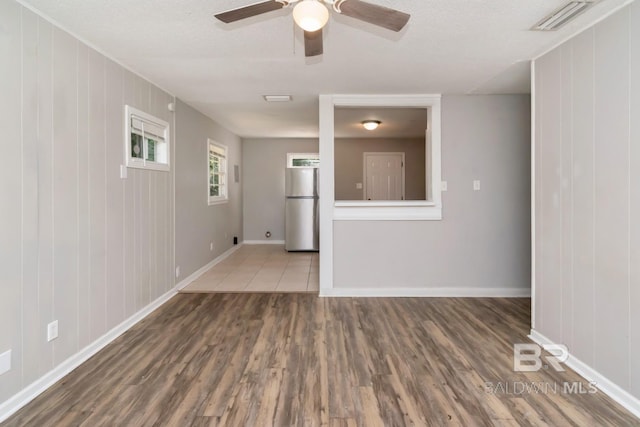 6451 S Barker Dr, Mobile, AL 36608 - unfurnished room featuring wood finished floors, ceiling fan, and baseboards