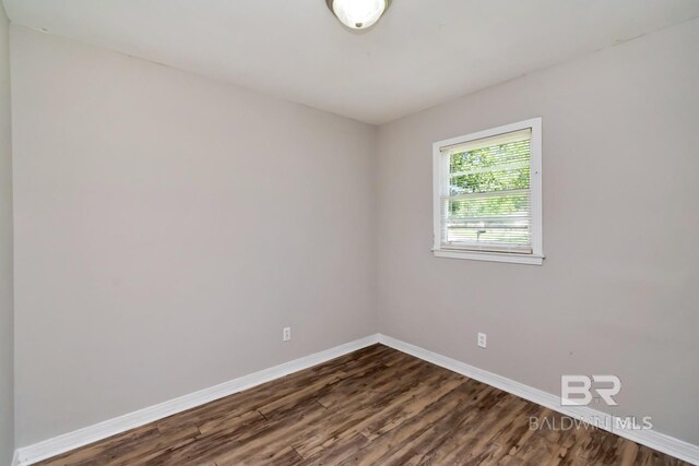 6451 S Barker Dr, Mobile, AL 36608 - empty room with baseboards and dark wood-style flooring