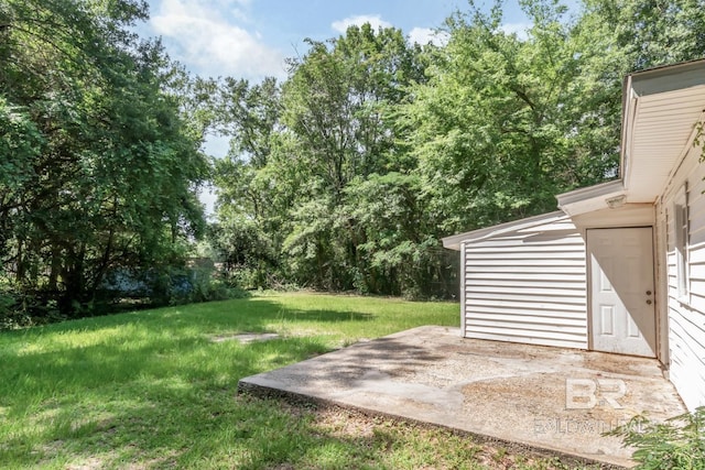 6451 S Barker Dr, Mobile, AL 36608 - view of grassy yard with a patio area