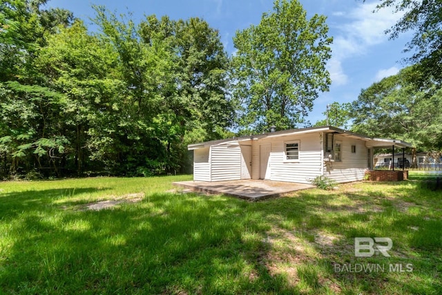 6451 S Barker Dr, Mobile, AL 36608 - view of grassy yard with a patio area