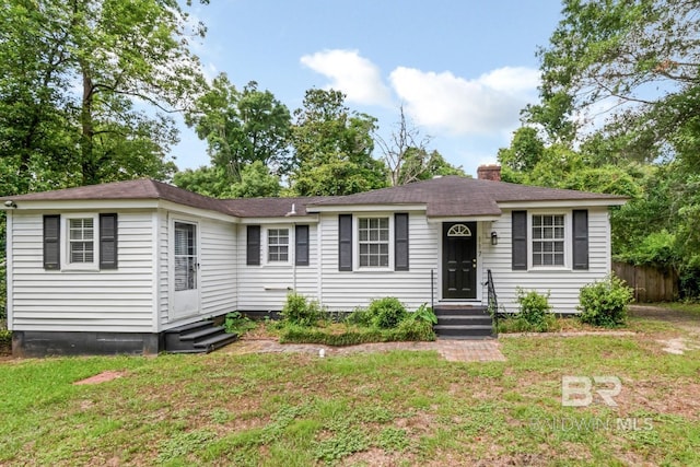 117 Border Dr, Mobile, AL 36608 - view of front facade with entry steps, a chimney, and a shingled roof