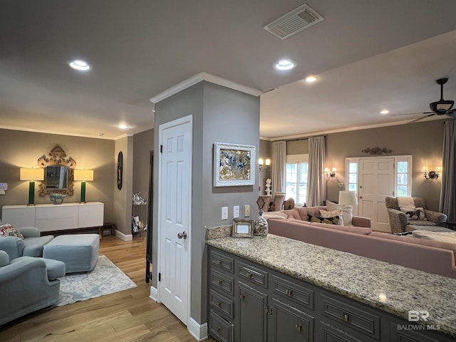 bathroom featuring hardwood / wood-style floors, ceiling fan, and crown molding