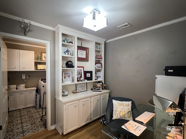 office featuring crown molding, dark hardwood / wood-style flooring, and washer and dryer