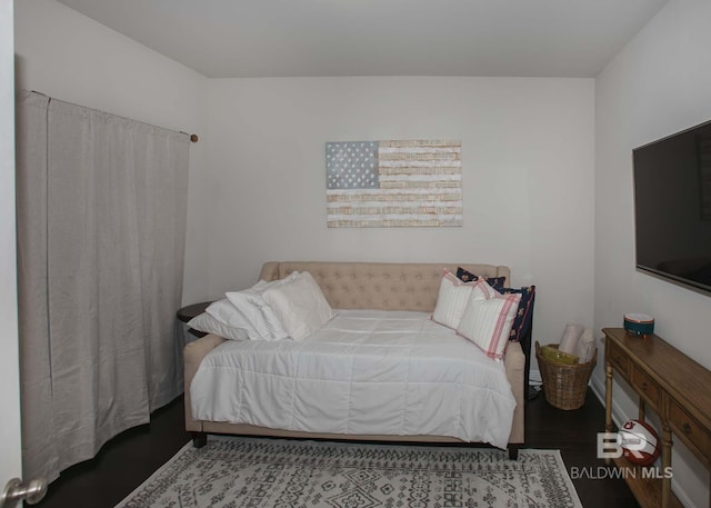 bedroom featuring wood finished floors