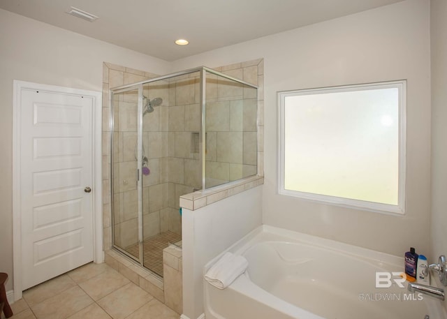 full bath featuring tile patterned floors, a stall shower, recessed lighting, and a garden tub