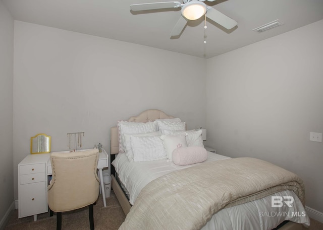 bedroom with carpet flooring, a ceiling fan, baseboards, and visible vents