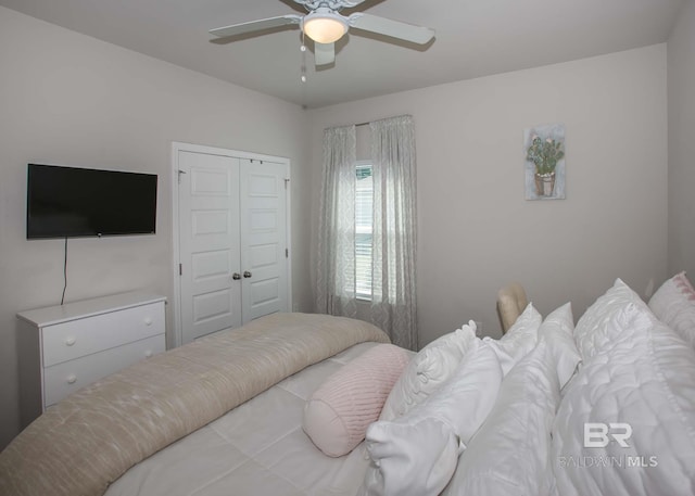 bedroom featuring a closet and a ceiling fan