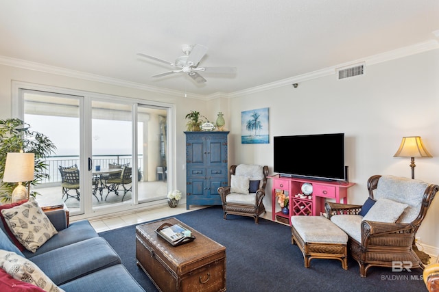 carpeted living area with visible vents, crown molding, and ceiling fan