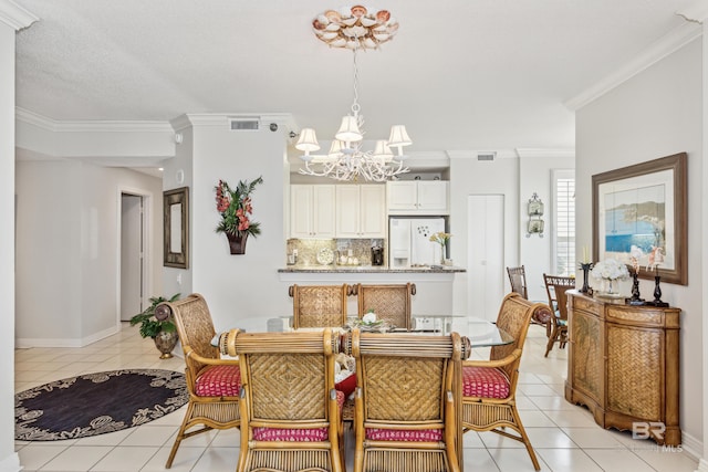 dining area featuring a notable chandelier, crown molding, visible vents, and light tile patterned floors