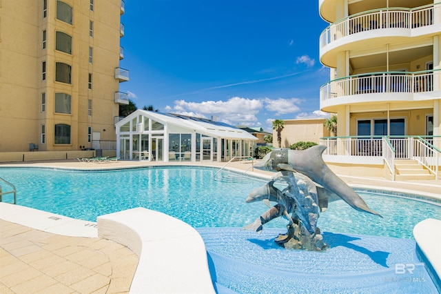 pool with a patio area